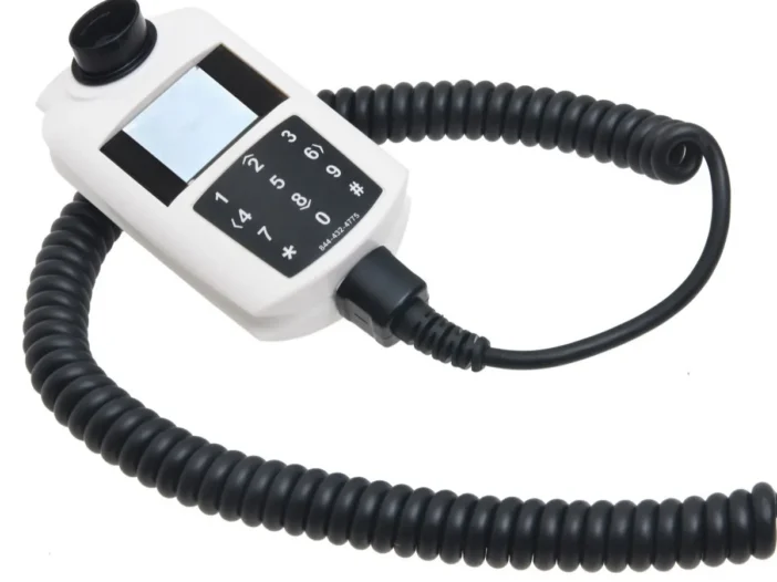 Handheld ignition interlock device with keypad and coiled cord on a white background