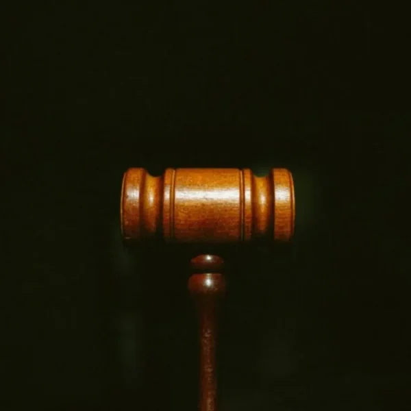 Wooden judge's gavel on a dark background, standing for a court-ordered breathalyzer requirement.