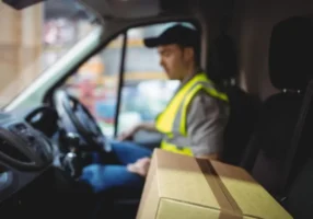 Delivery driver at the wheel of a work van, the kind of driver who may ask about an ignition interlock exemption.