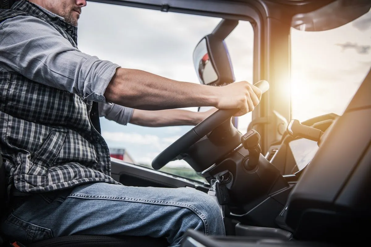 Commercial driver at the wheel of an employer-owned truck, where a work exemption may apply.